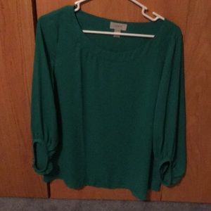Teal long sleeved shirt.
